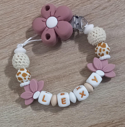 Attache tétine personnalisée. Modèle Lexy, thème fleur et jungle. Cadeau naissance, baby shower, jeunes parents. Création française.