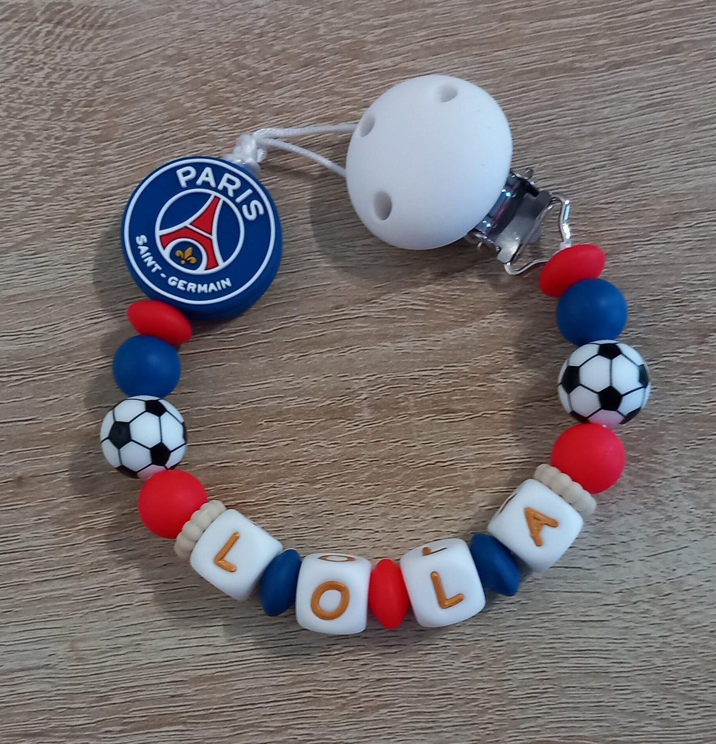 Attache tétine personnalisée Paris Saint Germain. Modèle Lola PSG pour fille et garçon. Cadeau naissance. Création française, fait main.
